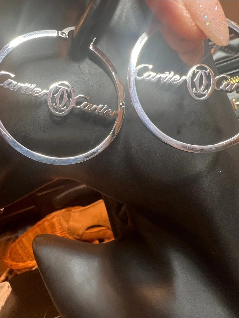 Stainless Steel Silver Hoop Logo Earrings with Subtle Rose Tint